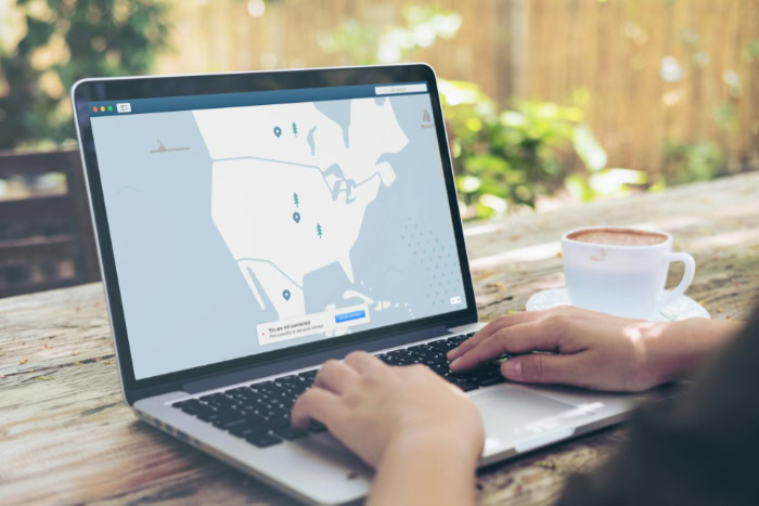 Laptop open with VPN interface on outdoor table