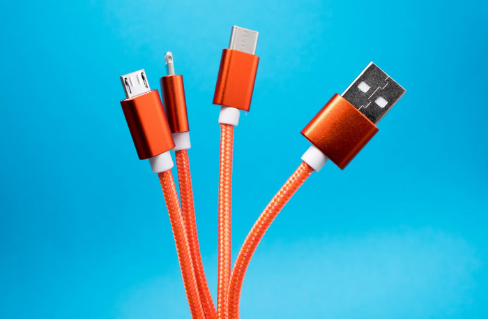 Orange USB C and Micro USB cables on blue background