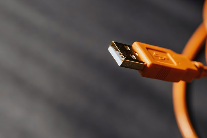 Orange USB cable close up with Type A connector