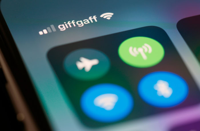 Smartphone WiFi and signal icons on screen closeup